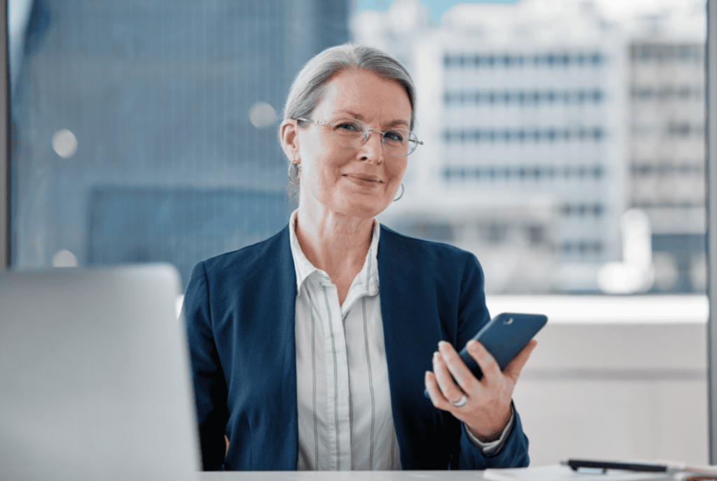 A woman on her phone ready to optimize workflow in her workplace