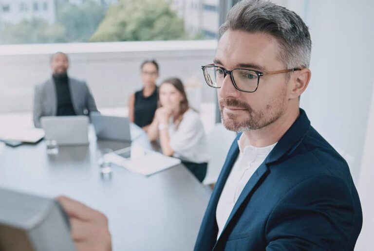 manager recognizes importance of sop in business and cascades it to employees in a meeting