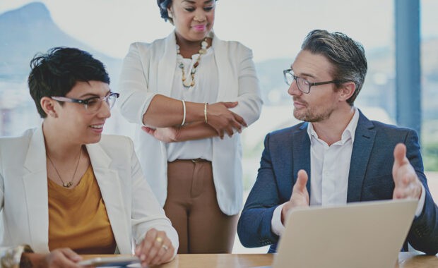 employees and manager identifying project stakeholders in a meeting