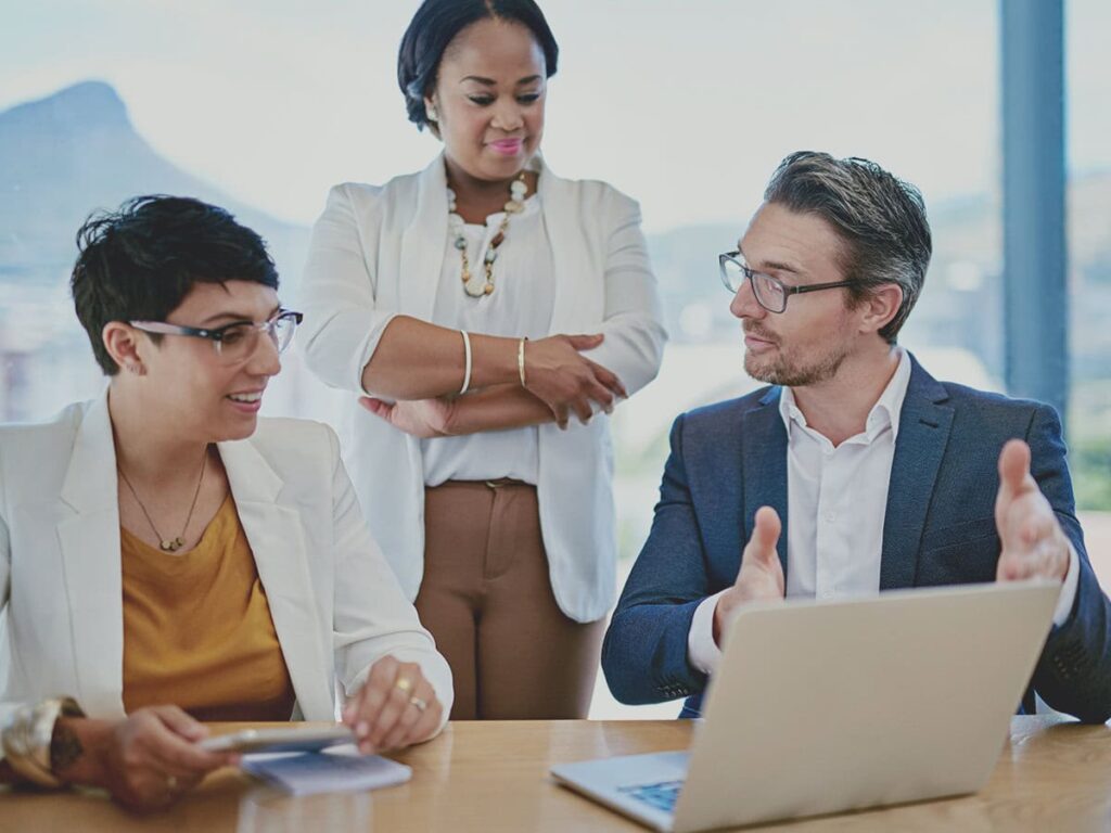 employees and manager identifying project stakeholders in a meeting
