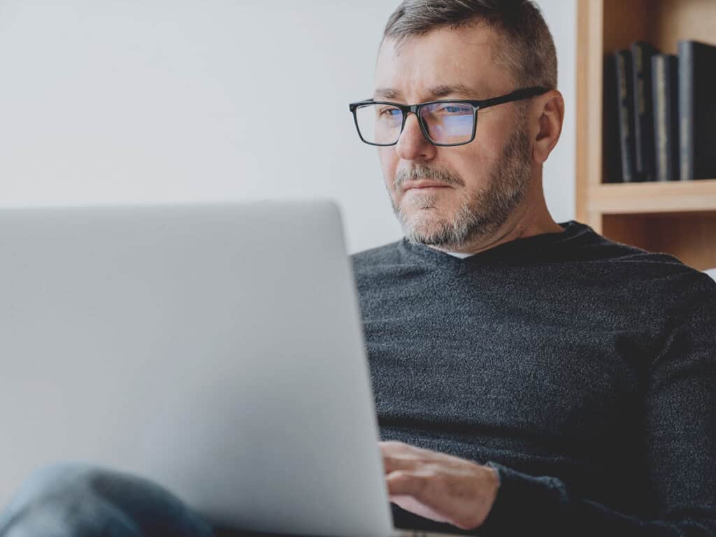 a male business owner looking up how to optimize hubspot for a better business workflow