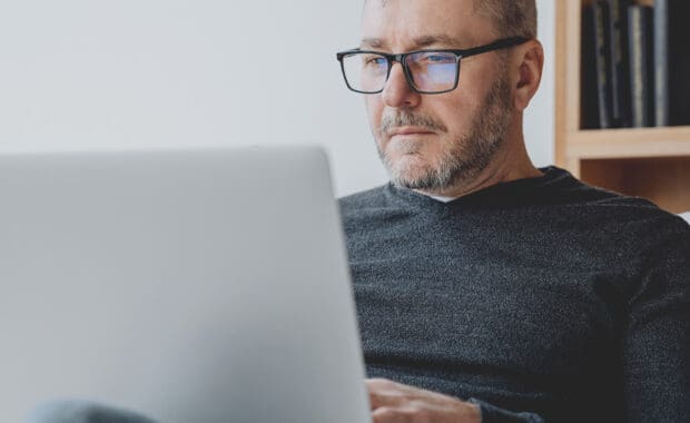 a male business owner looking up how to optimize hubspot for a better business workflow