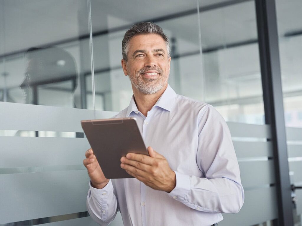 a male project manager going over project management mistakes on his device