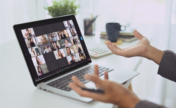 a business owner managing distributed teams via working online in a work from home set up