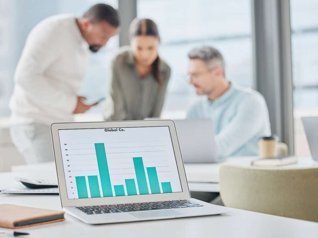 a business owner and two project managers undergoing project management evaluation after seeing the data from their latest project