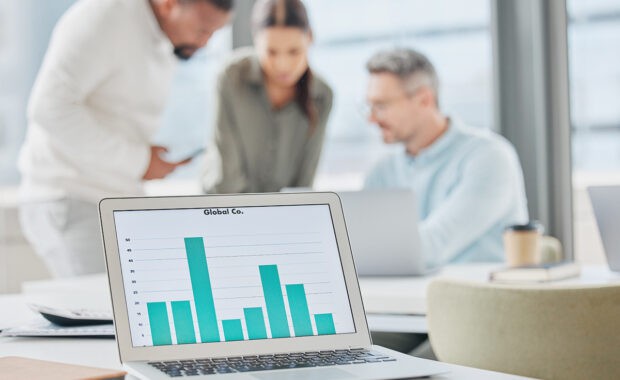 a business owner and two project managers do a project management evaluation after seeing the data from their latest project