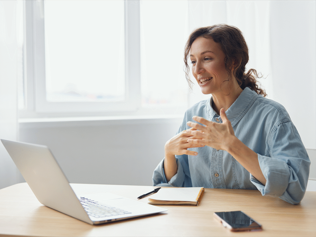 Small business owner discussing project takeover in a virtual meeting with her team