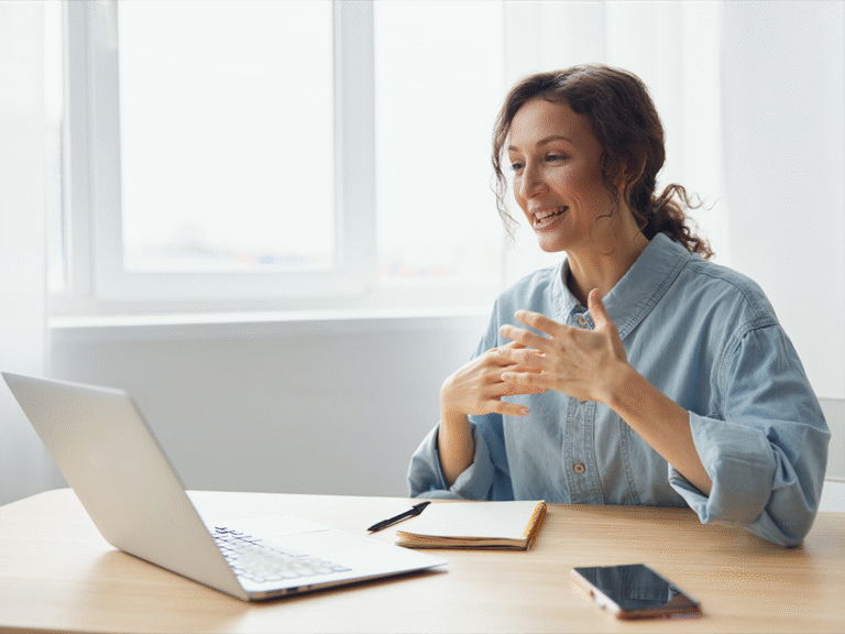 Small business owner discussing project takeover in a virtual meeting with her team