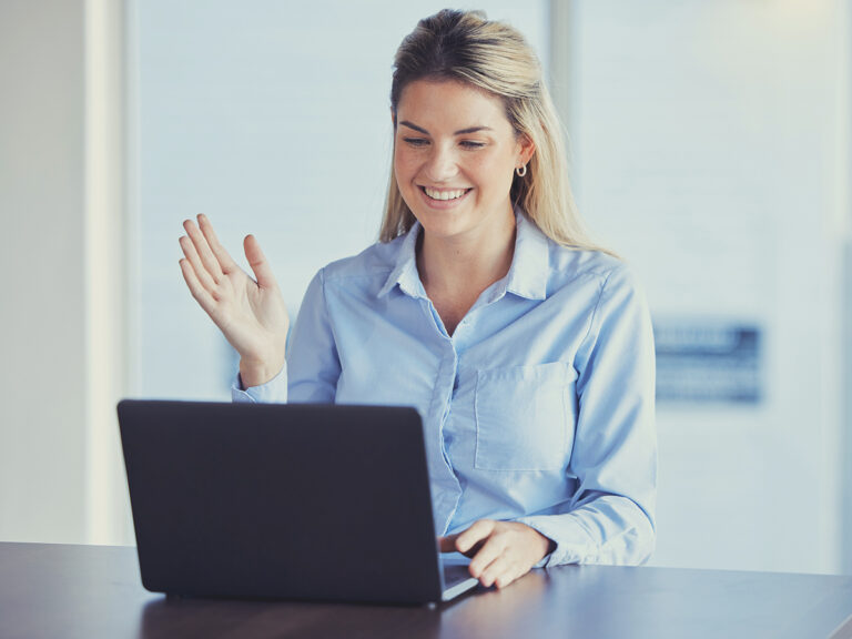 Female employee working from home and engaging in remote collaboration for a project