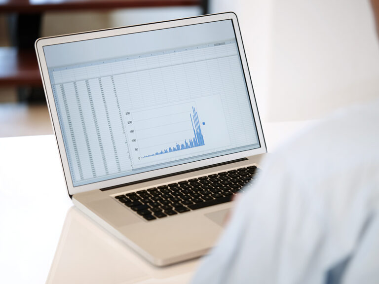 a laptop screen showing data being reviewed in the process of conducting operational audits