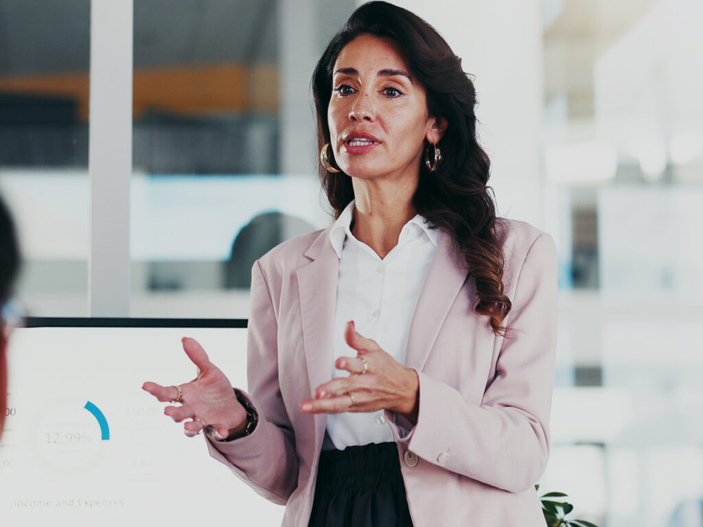 Female small business owner sharing how plans to scale a business can fall apart during a team meeting