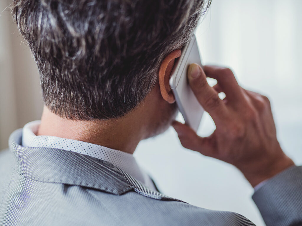 a business owner clearing up business miscommunication with a phone call