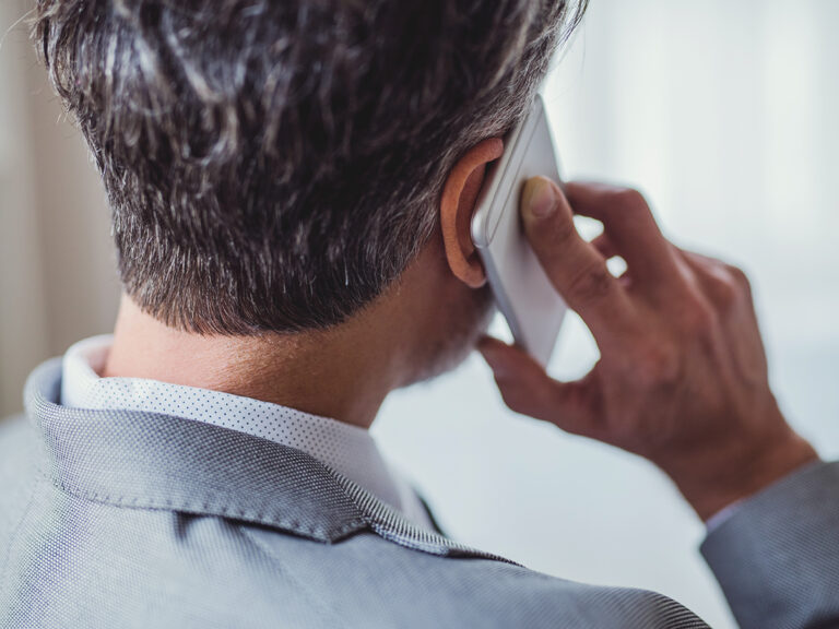 a business owner clearing up business miscommunication with a phone call